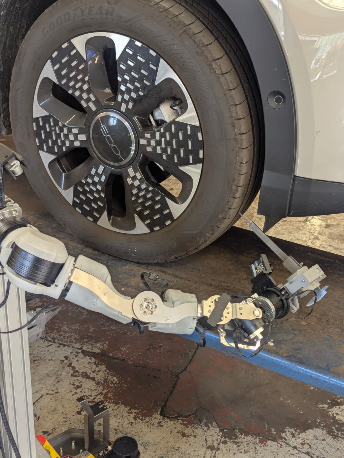 The prototype positioning a tread depth gauge at a tyre